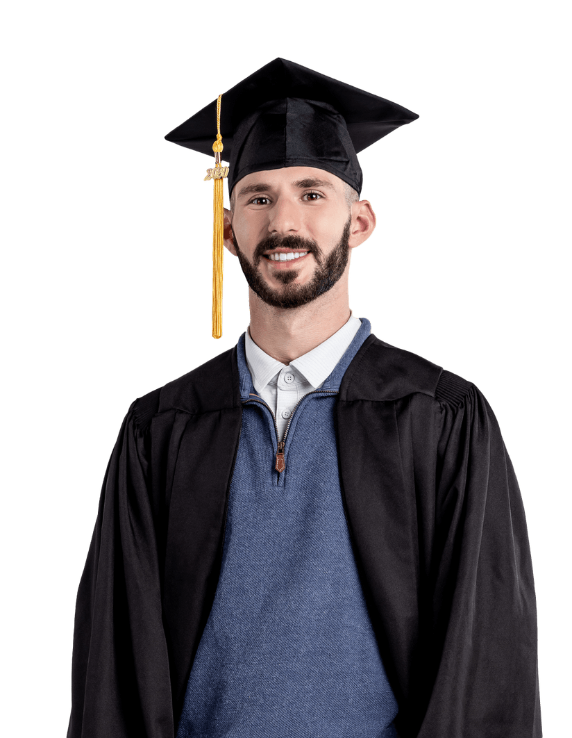 A young man with a beard wearing a black graduation cap and gown over a blue sweater and collared shirt, smiling at the camera against a plain white background.